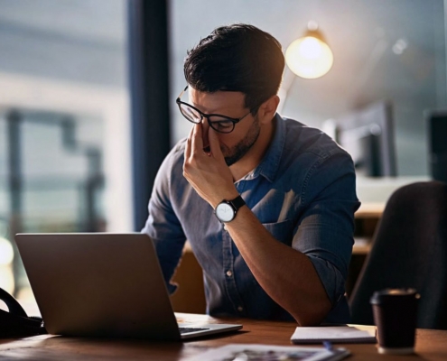 a man suffering from Digital Eye Strain